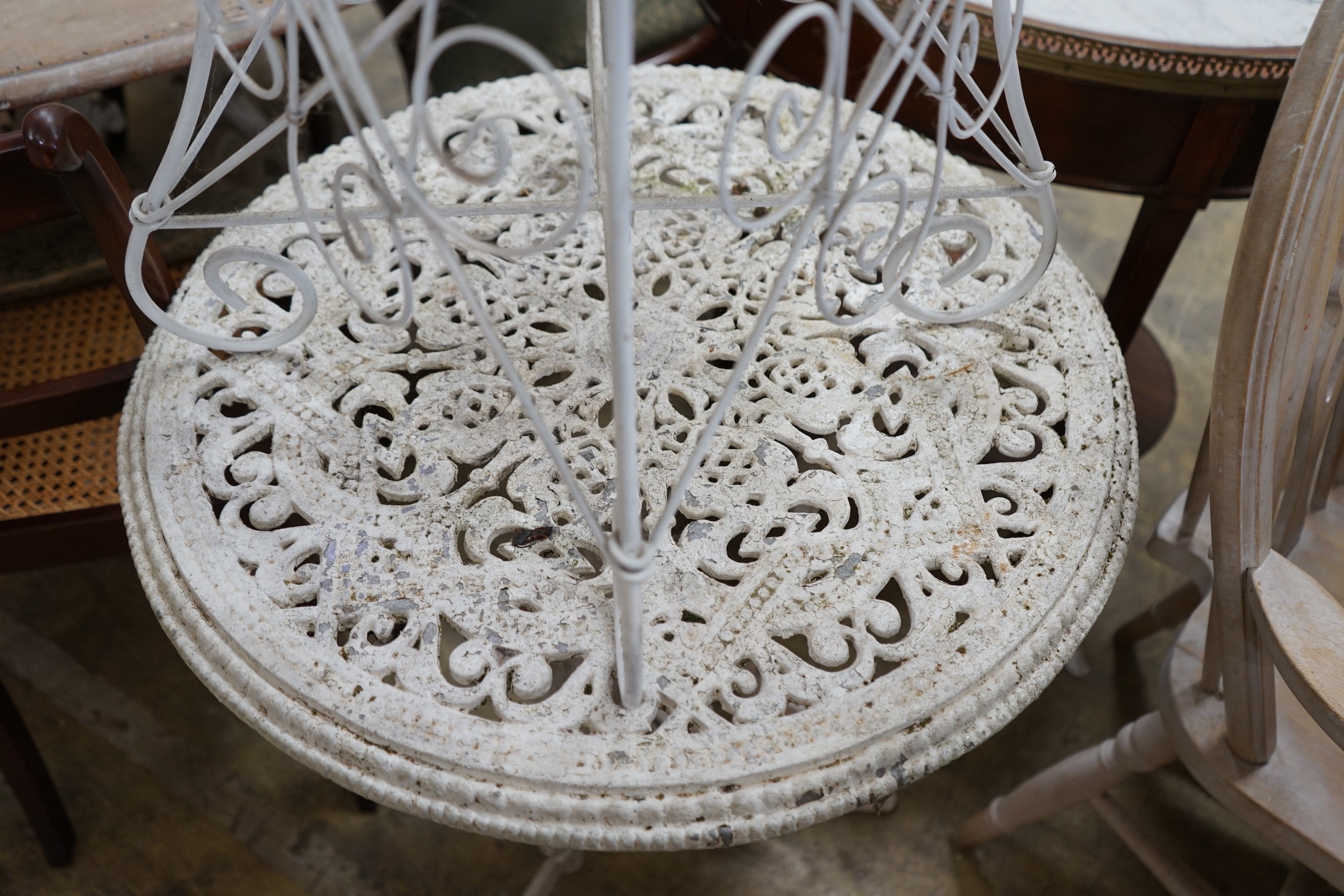 A painted wirework circular garden table and a painted aluminium garden table, larger diameter 60cm, height 70cm